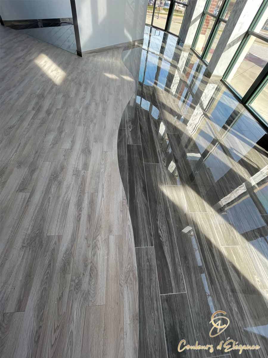 A commercial space featuring a blended floor with two different types of flooring.