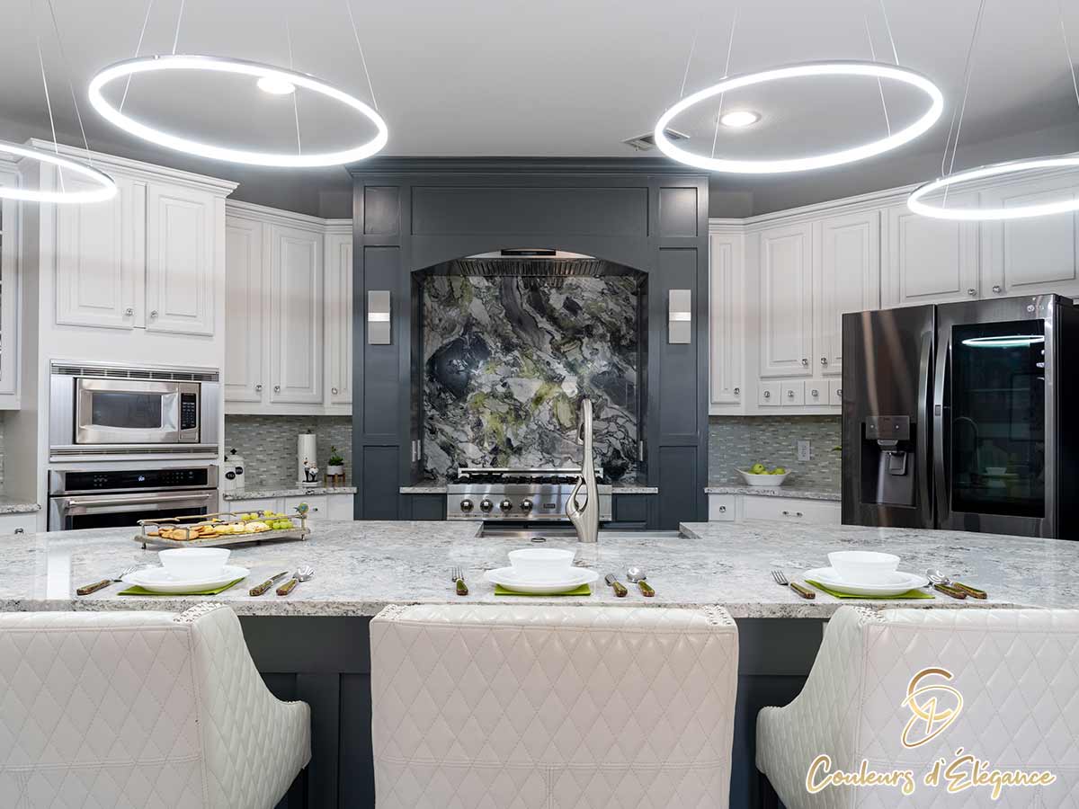 A beautifully designed residential kitchen featuring the island and stove area.